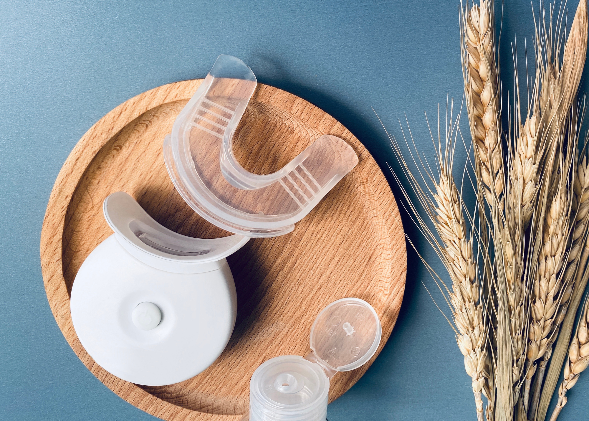 A woman using MySmile teeth flosser