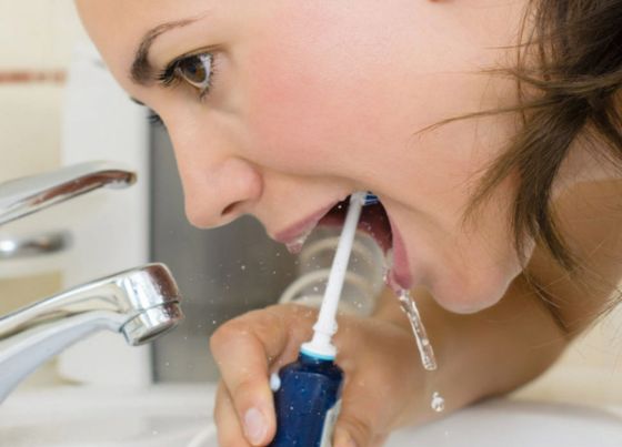 why dentist recommend water flossing