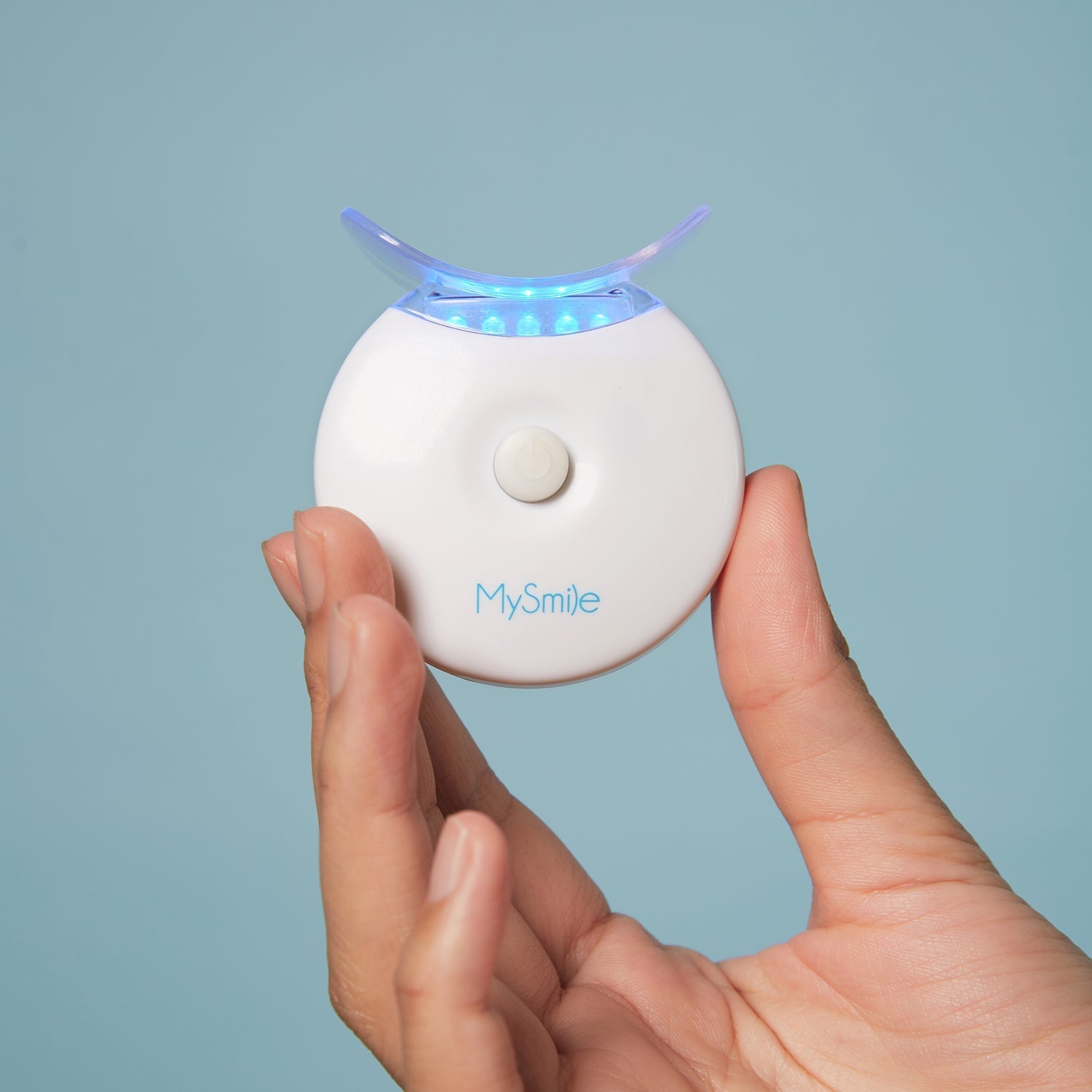 teeth whitening device with the blue LED light turned on