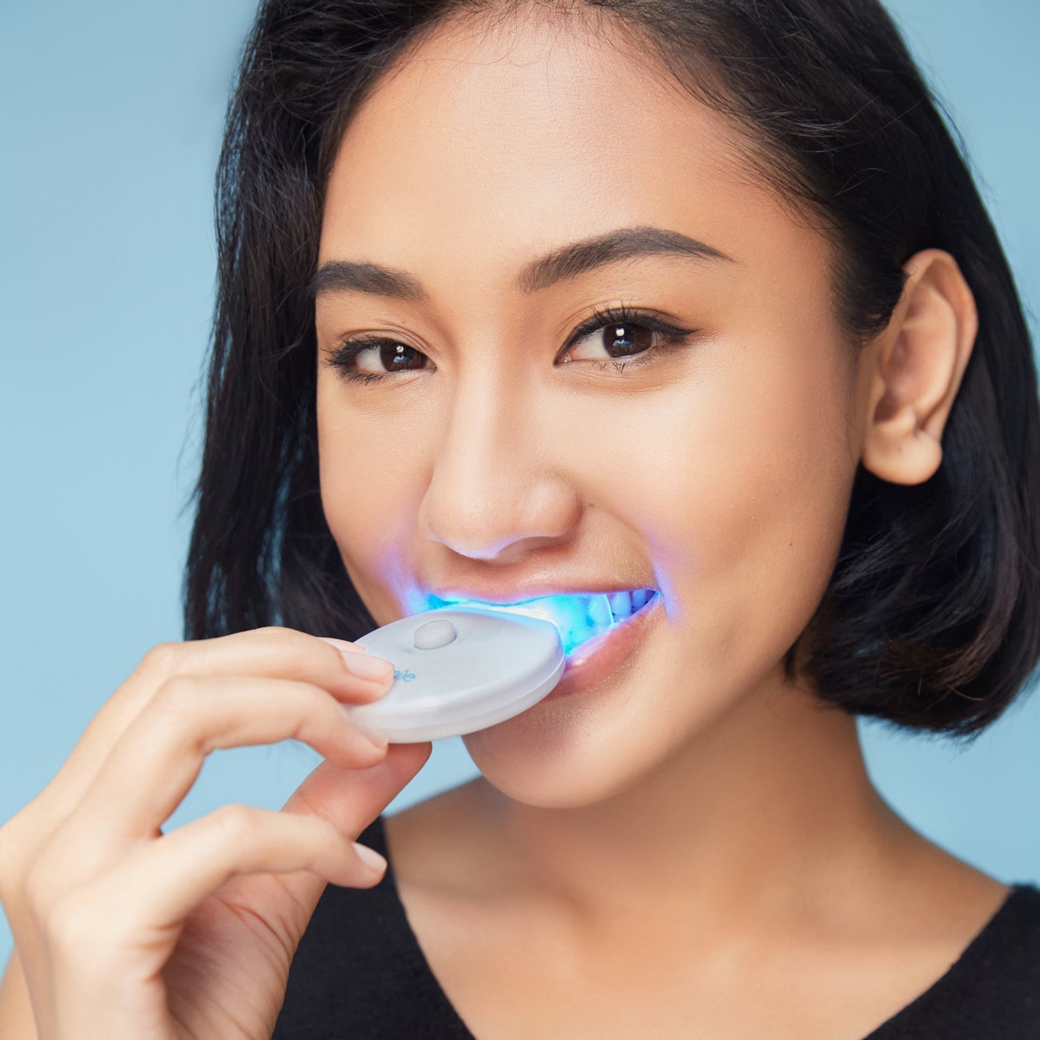 teeth whitening device with the blue LED light activated