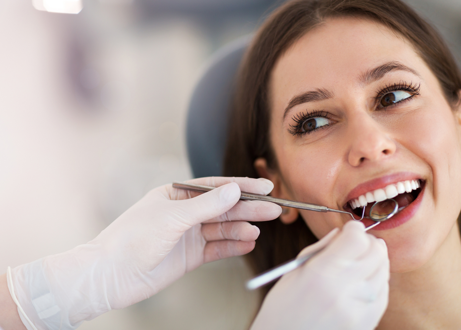 woman using MySmile Whitening Strips in dental